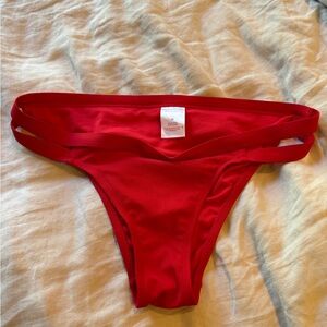 Red bathing suit bottoms.